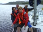 Cheerful crew posing while at anchor in the Burnt Isles, Kyles of Bute